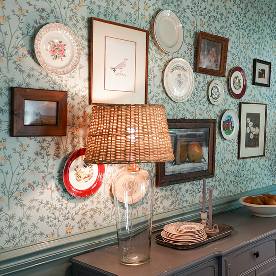 Six-image carousel of living room, child’s room, entryway, backyard and kitchen, all incorporating Renew Blue.