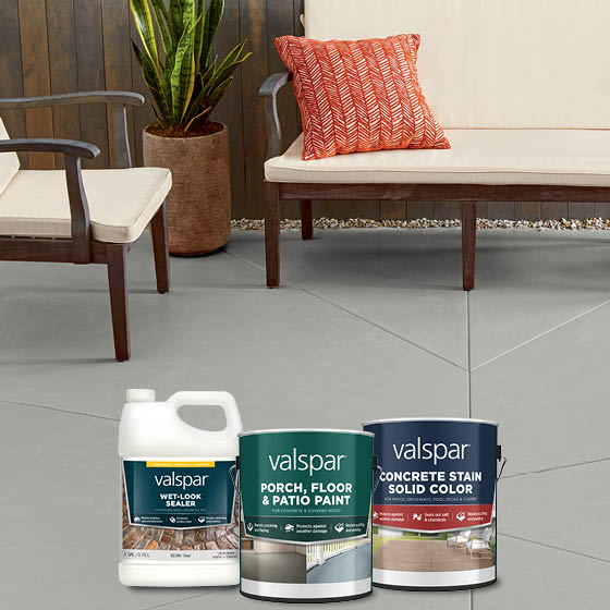 Gray cement patio, a modern outdoor couch and chair, plus Valspar Porch, Floor, and Patio products.